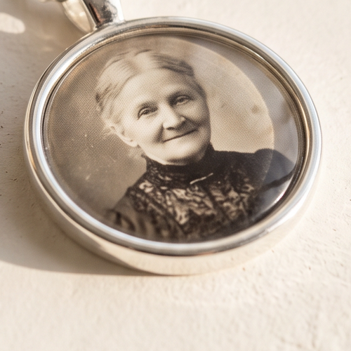 Close-up of an Evercarry silver-plated photo charm, shown without a chain